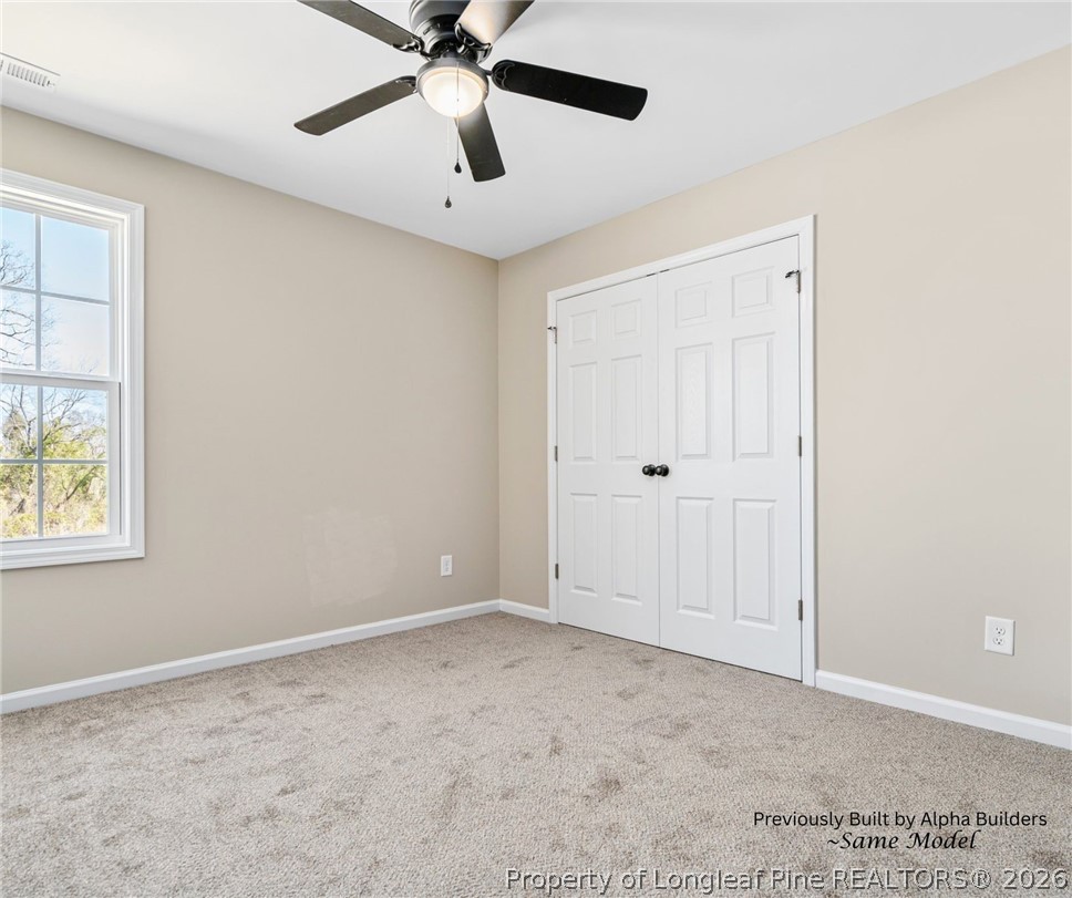 973 Martin Road St. Pauls, NC 28384 - Photo 6 of 19 Spacious primary suite conveniently located on the main level with large walk-in closet.