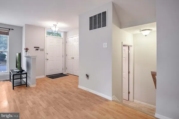 a view of a livingroom with furniture and front door
