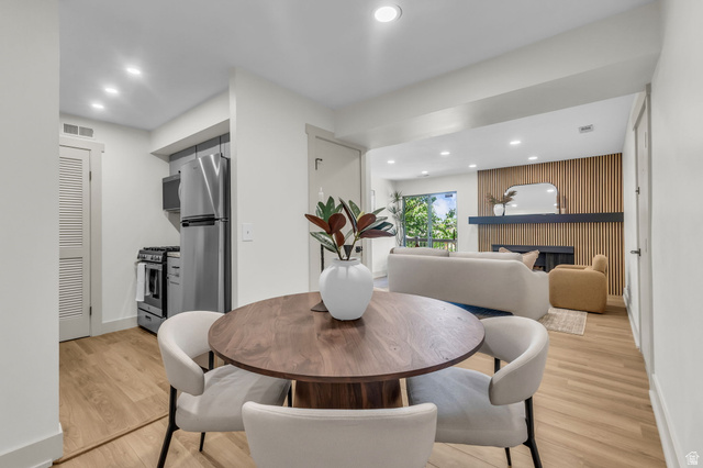 88 West 50 South, Unit C8 Centerville, UT 84014 - Photo 6 of 29 Open-concept living space featuring wood-finish flooring, recessed lighting, and white walls