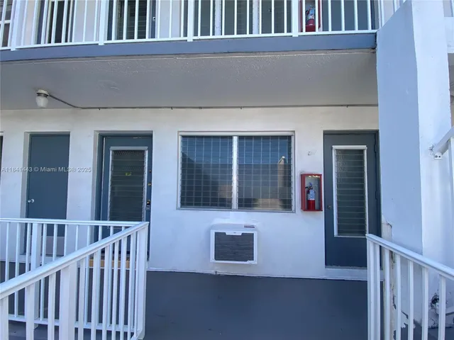 a living room with a large window and a table