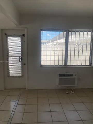 a white toilet sitting next to a shower curtain