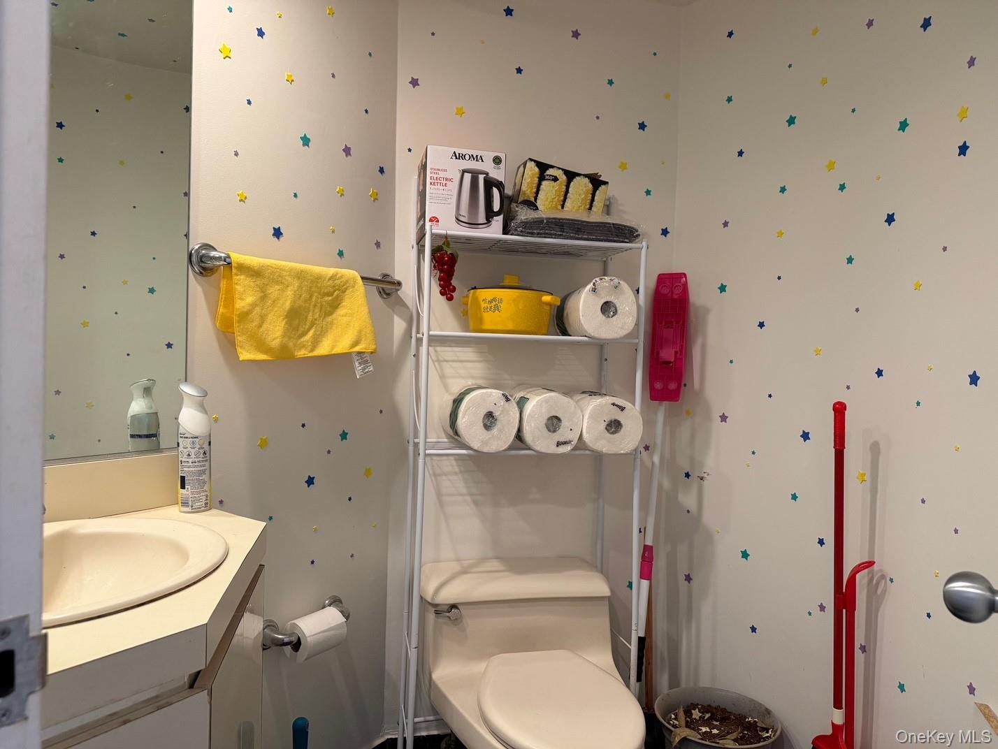 88 Cutter Mill Road, Unit 308 Great Neck, NY 11021 - Photo 11 of 15 Bathroom with vanity and wallpapered walls