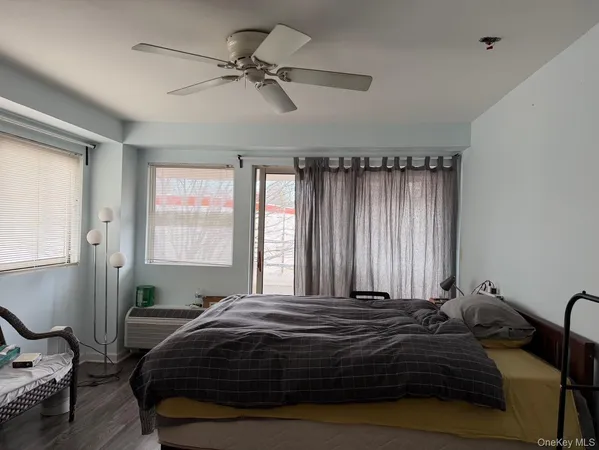 a bedroom with a bed and window