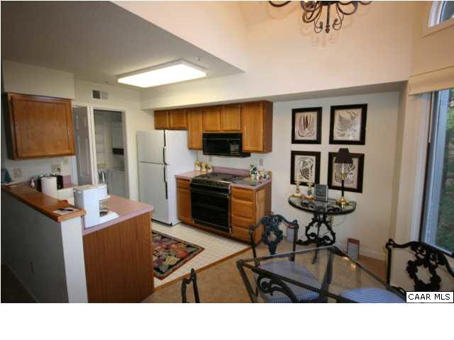 2012 Stone Rdg Wds Roseland, VA 22967 - Photo 6 of 19 a living room view with furniture a flat screen tv and a refrigerator