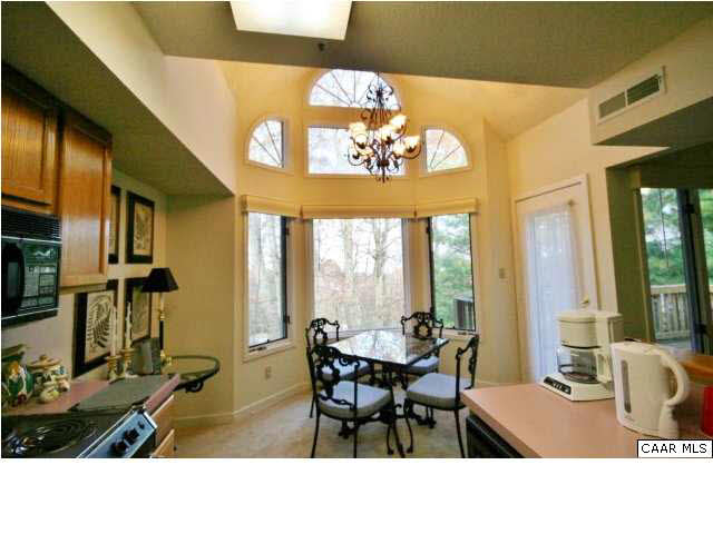 2012 Stone Rdg Wds Roseland, VA 22967 - Photo 7 of 19 a living room with dining table furniture a chandelier and a large window