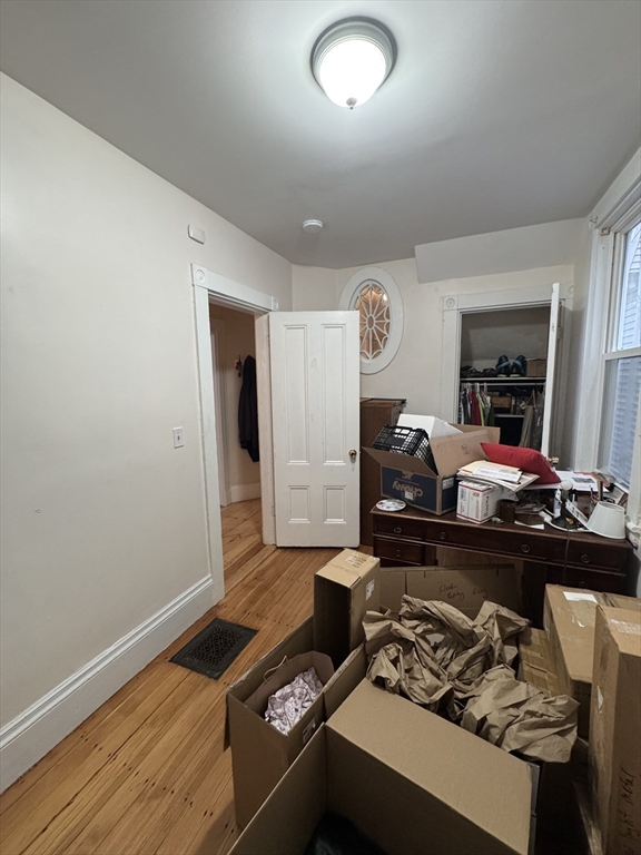 5 Spring Park Avenue, Unit 1 Boston, MA 02130 - Photo 18 of 24 a living room with furniture and a wooden floor