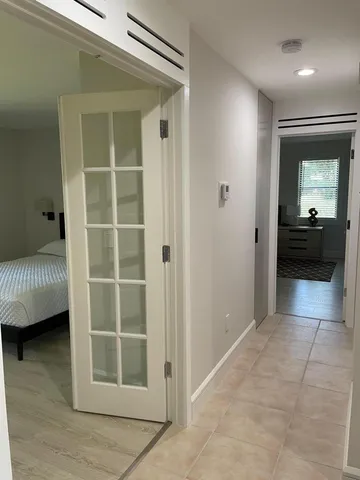a view of a livingroom with entryway and bedroom