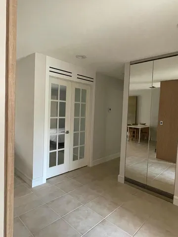 a view of empty room with windows