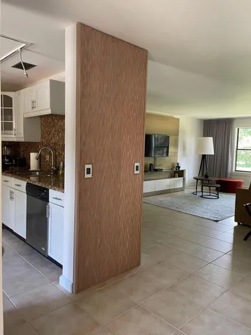 a lobby with furniture and a view of living room
