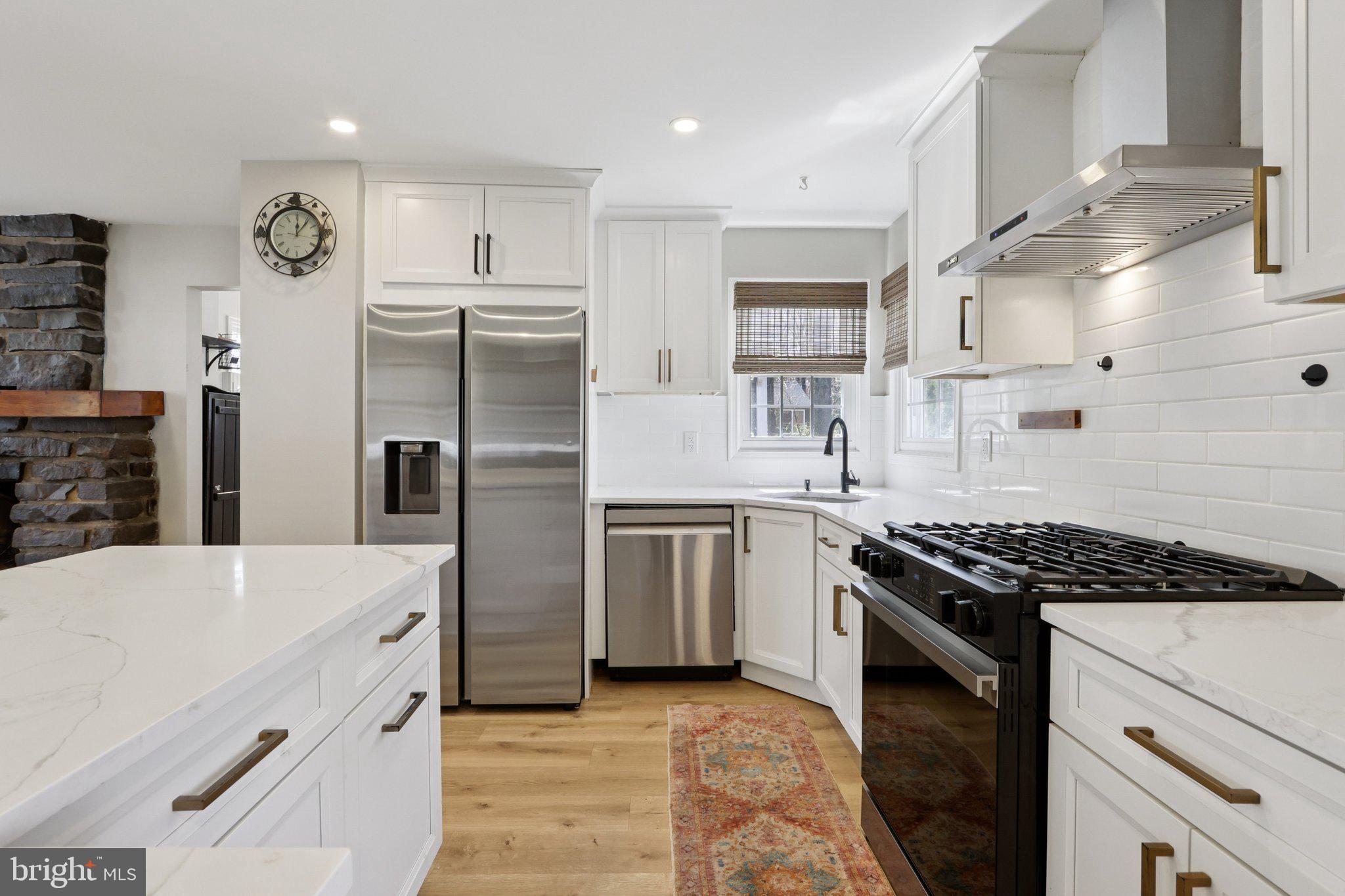 351 Merrick Road Robbinsville, NJ 08691 - Photo 22 of 69 a kitchen with stainless steel appliances granite countertop a stove and a refrigerator