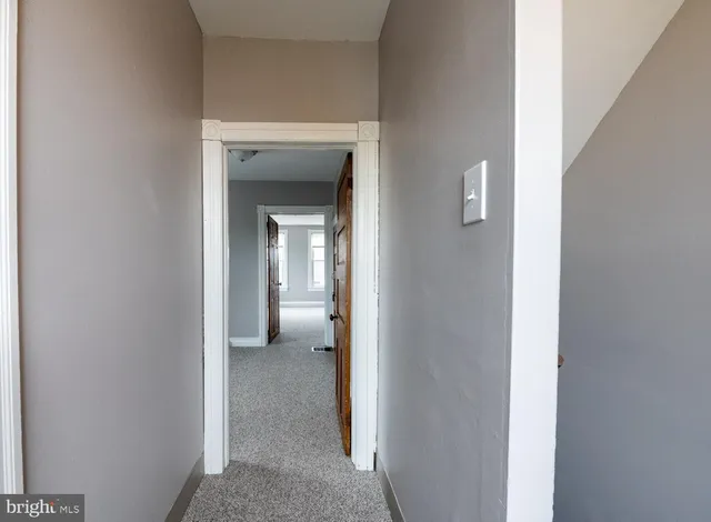 a view of a livingroom from a hallway