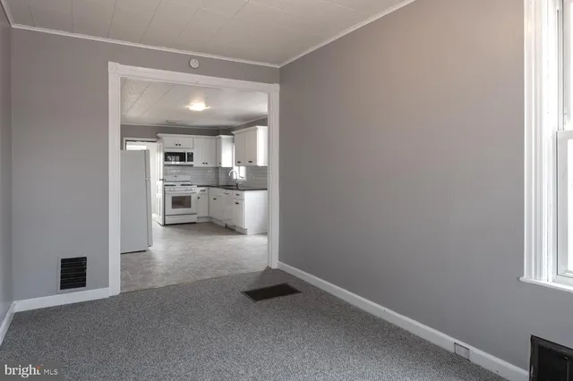 a view of a kitchen and a window