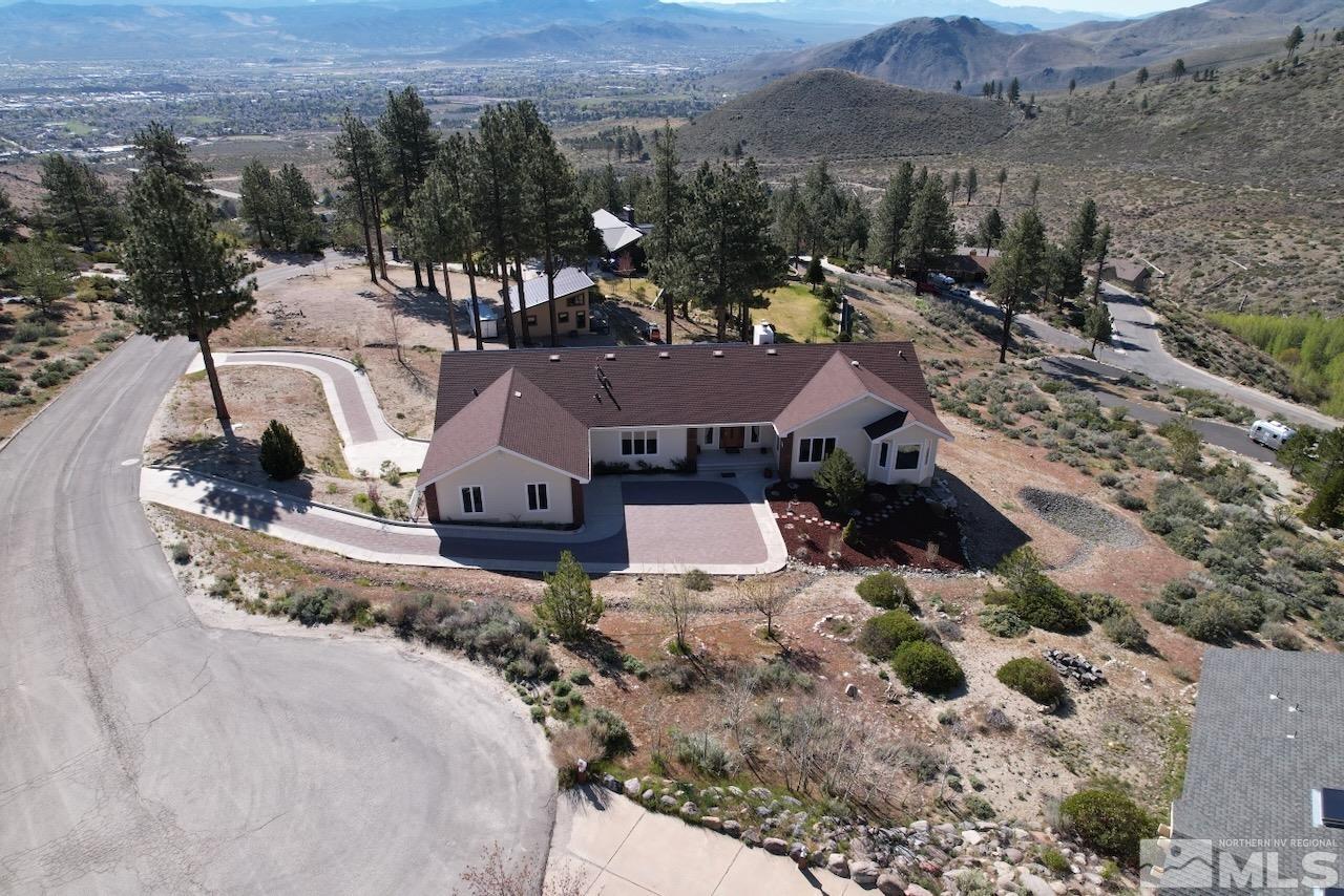 a view of a house with a mountain in the background
