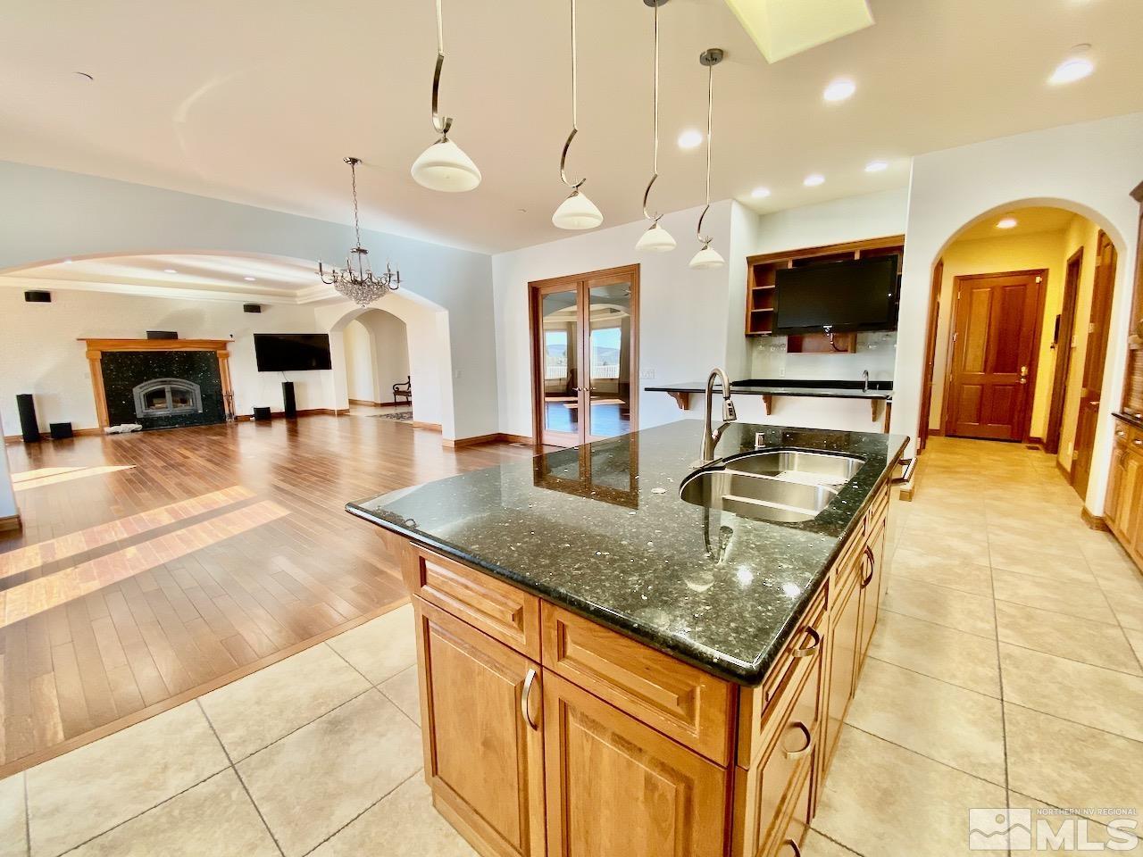 3807 Paradise View Carson City, NV 89703 - Photo 17 of 40 a kitchen with stainless steel appliances granite countertop a sink and dining table