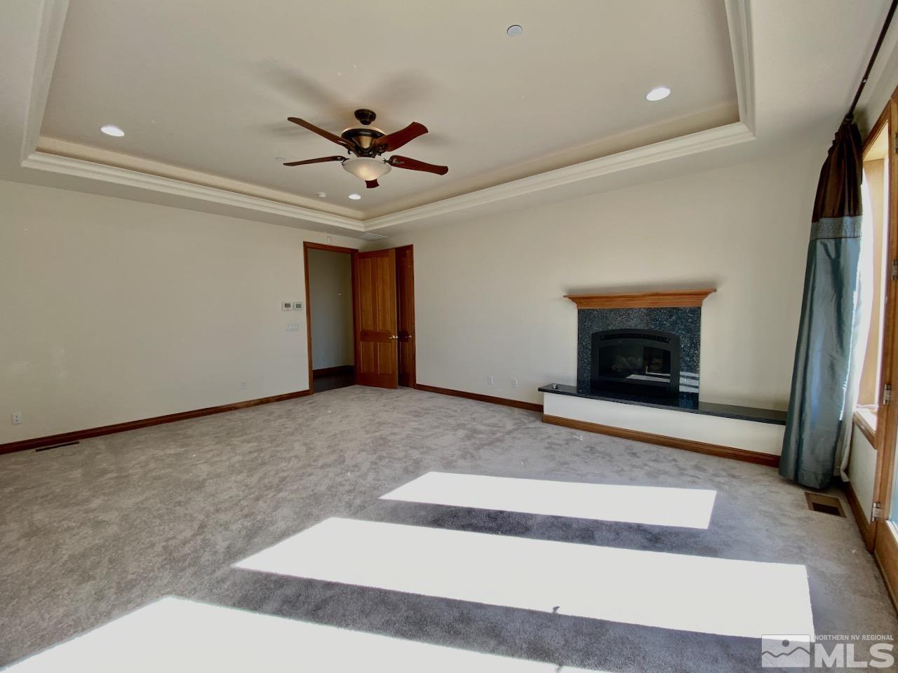 3807 Paradise View Carson City, NV 89703 - Photo 21 of 40 a view of an empty room with a fireplace