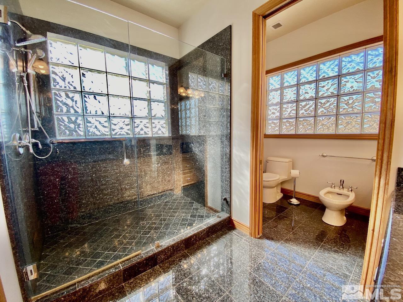 3807 Paradise View Carson City, NV 89703 - Photo 23 of 40 a bathroom with a toilet sink and a shower