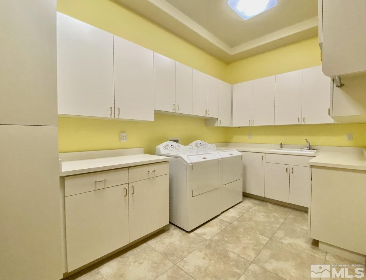 3807 Paradise View Carson City, NV 89703 - Photo 29 of 40 a utility room with cabinets washer and dryer