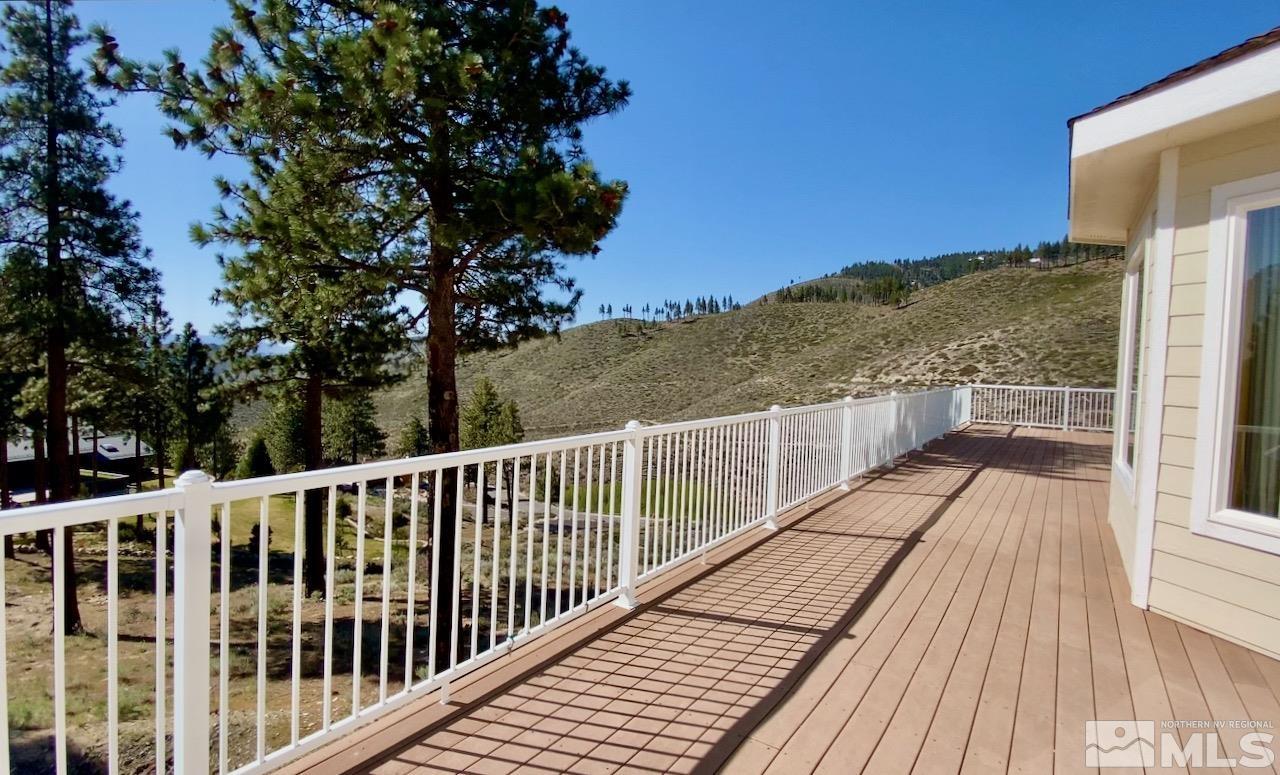 3807 Paradise View Carson City, NV 89703 - Photo 3 of 40 a view of balcony with wooden floor and fence