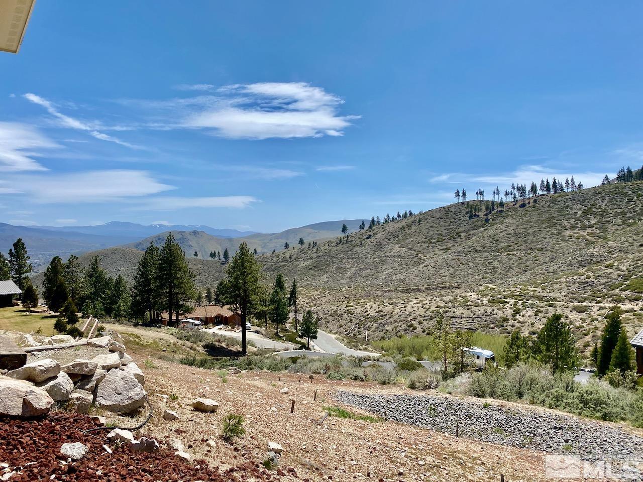 3807 Paradise View Carson City, NV 89703 - Photo 6 of 40 a view of a road with a building in the background