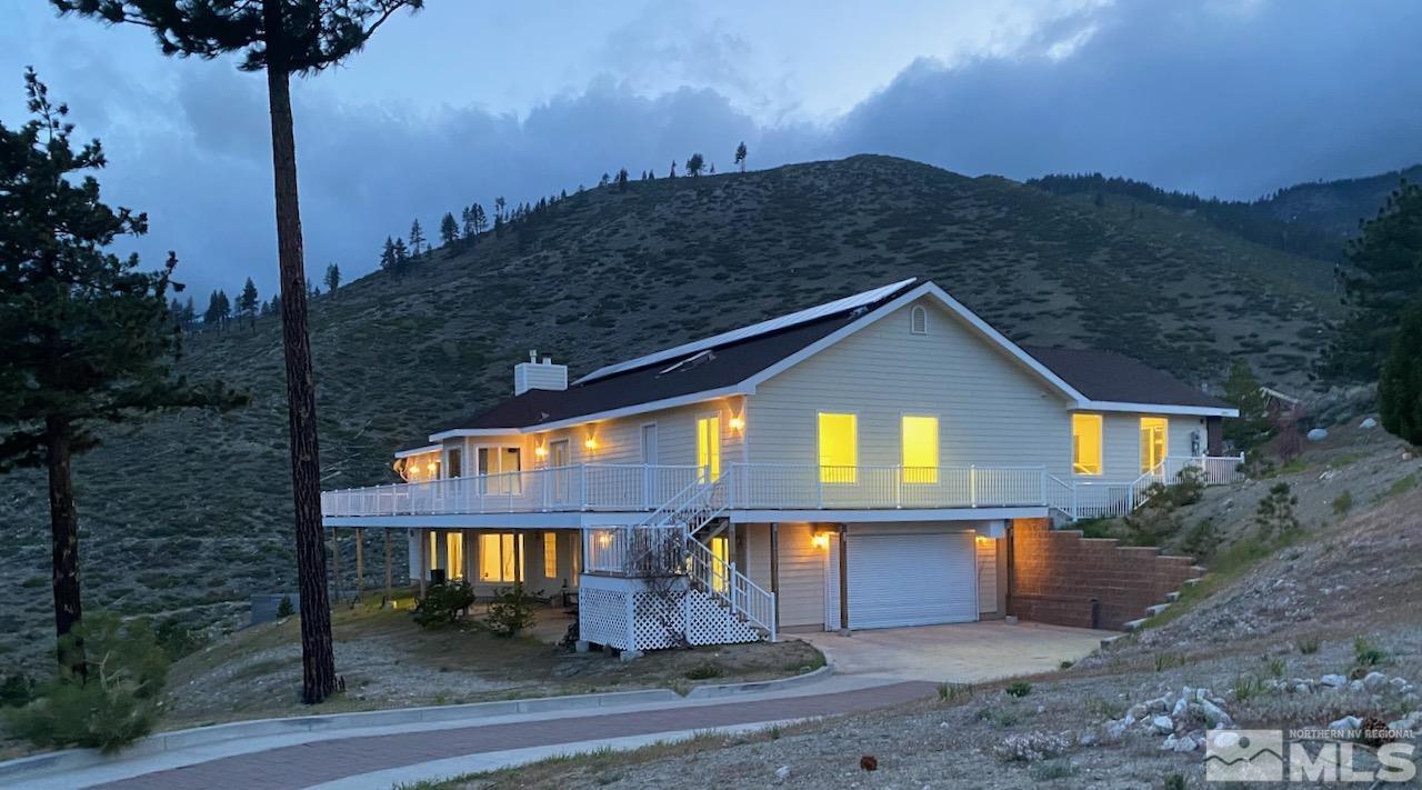 3807 Paradise View Carson City, NV 89703 - Photo 7 of 40 a front view of house with yard and trees in the background
