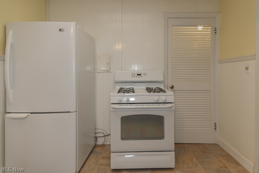 1271 Avondale Road Cleveland, OH 44121 - Photo 24 of 35 Kitchen appliances. Door leads to pantry and basement staircase
