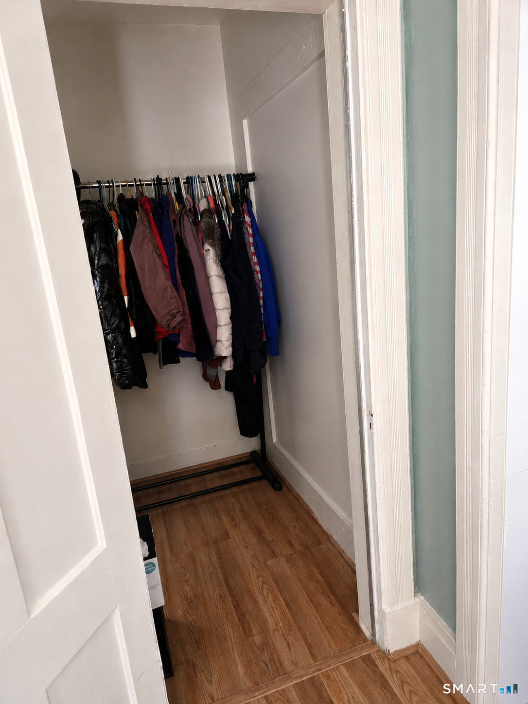 61 Bartlett Street Meriden, CT 06451 - Photo 27 of 30 a view of walk in closet with clothes and shoes