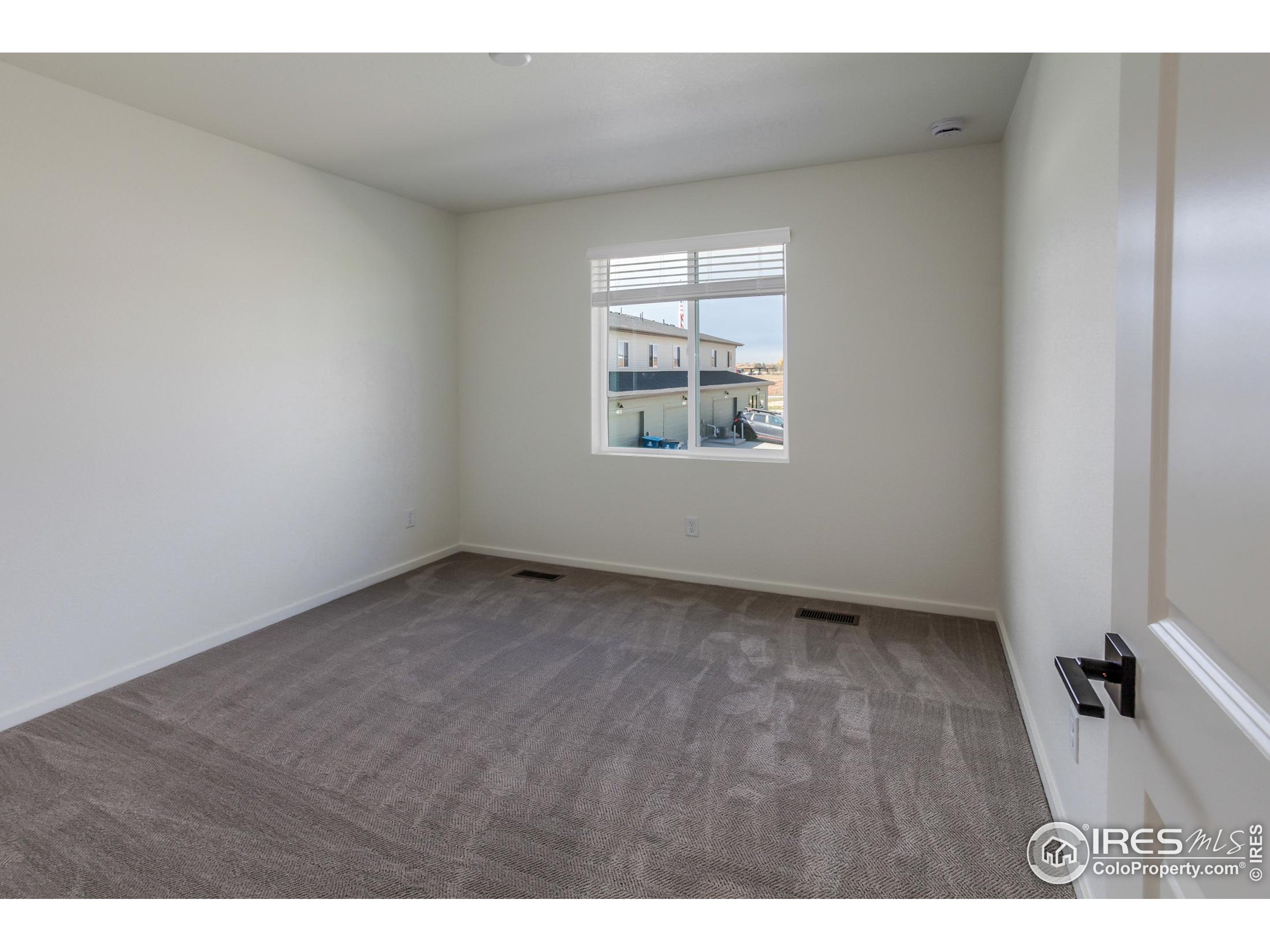 4909 Autumn Leaf Drive Timnath, CO 80547 - Photo 23 of 34 a view of an empty room with a window