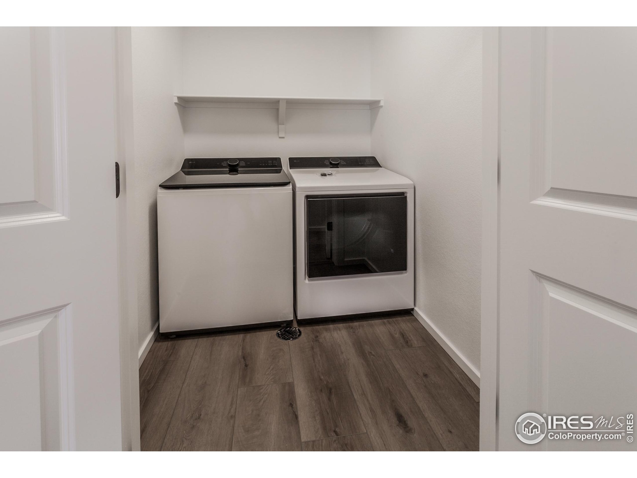 4909 Autumn Leaf Drive Timnath, CO 80547 - Photo 26 of 34 a utility room with washer and dryer