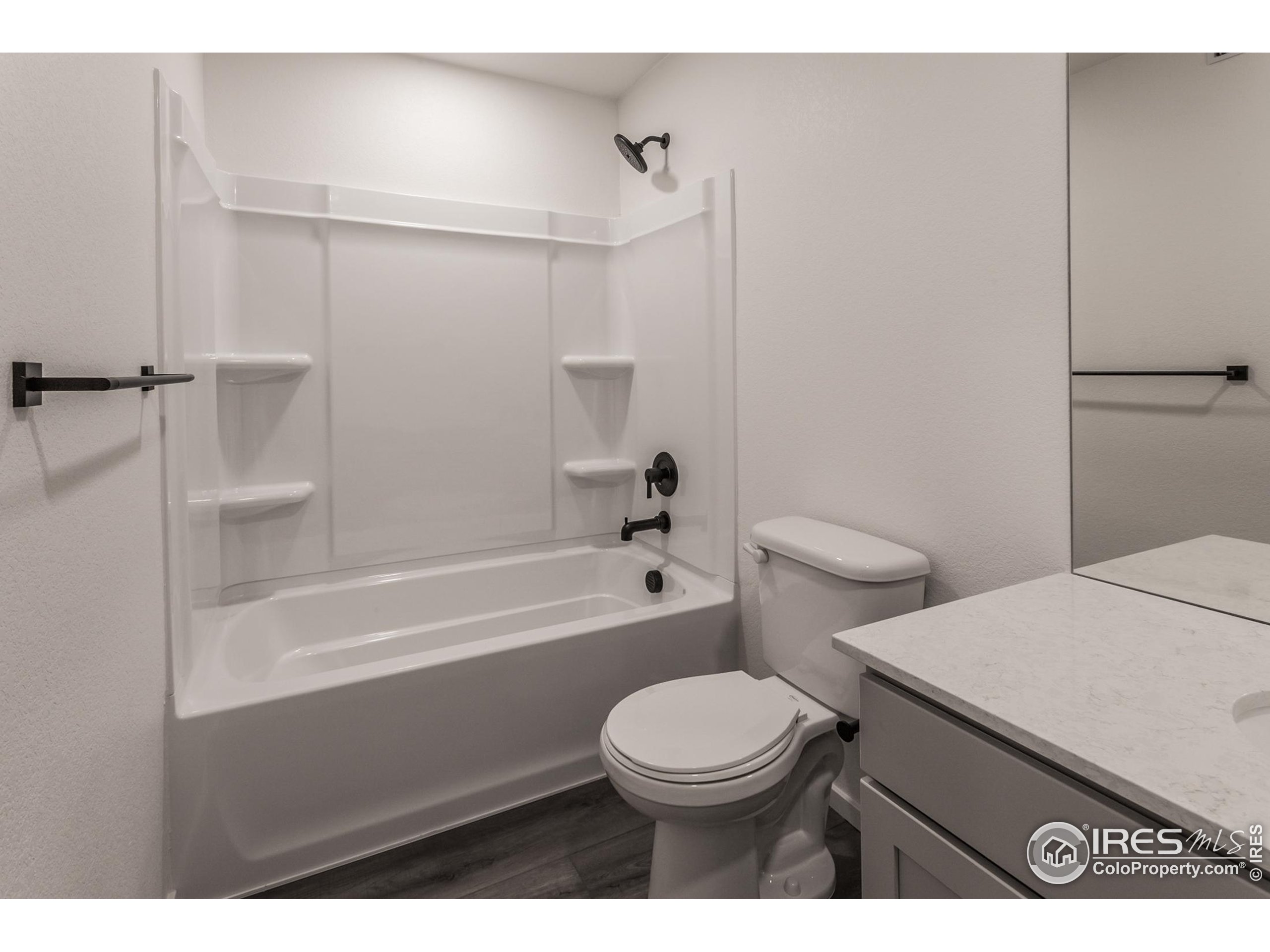 4909 Autumn Leaf Drive Timnath, CO 80547 - Photo 28 of 34 a bathroom with a toilet a sink and bathtub