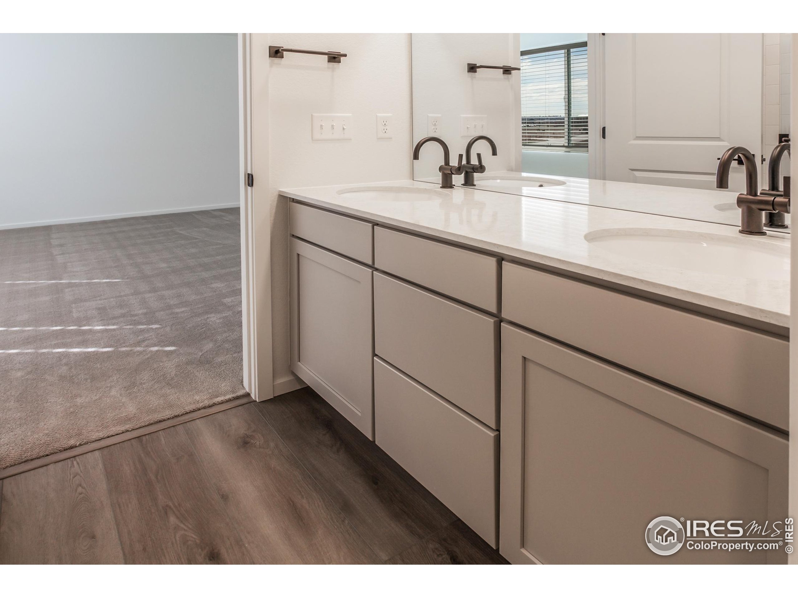 4909 Autumn Leaf Drive Timnath, CO 80547 - Photo 30 of 34 a bathroom with a sink and a mirror