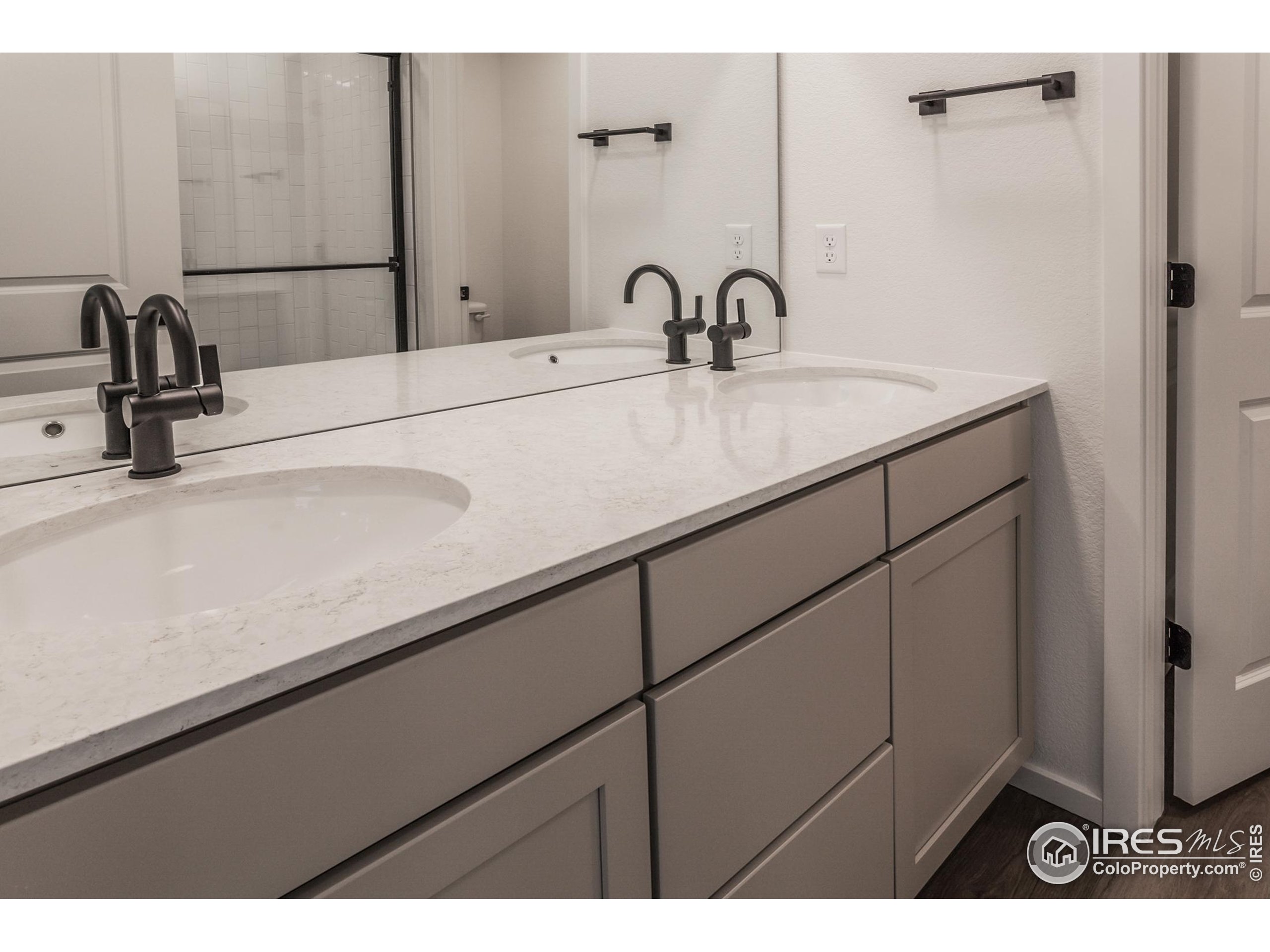 4909 Autumn Leaf Drive Timnath, CO 80547 - Photo 31 of 34 a bathroom with a sink and a mirror