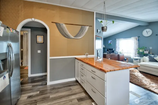 a spacious bathroom with a granite countertop sink a mirror and shower