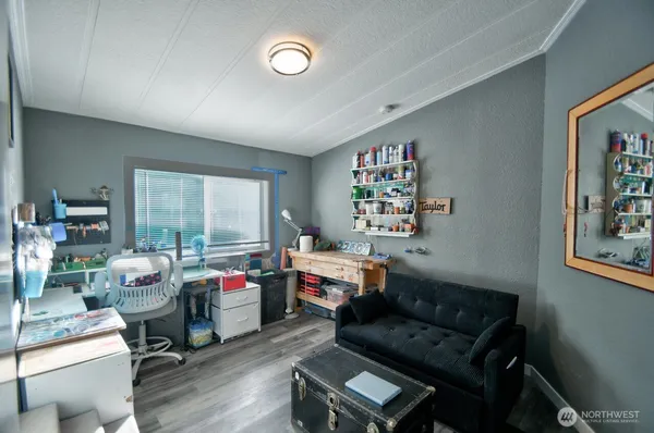 a reading room with furniture and a window