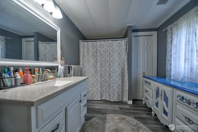 a kitchen with stainless steel appliances granite countertop a sink and a refrigerator