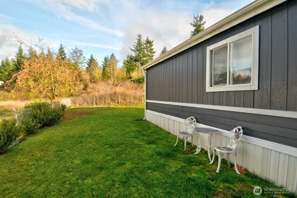 a backyard of a house with lots of green space