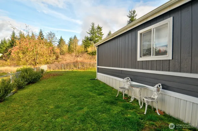 a backyard of a house with lots of green space