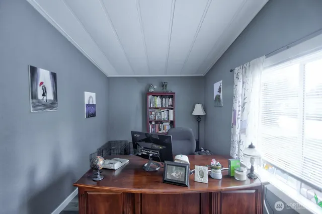 a work room with furniture and window