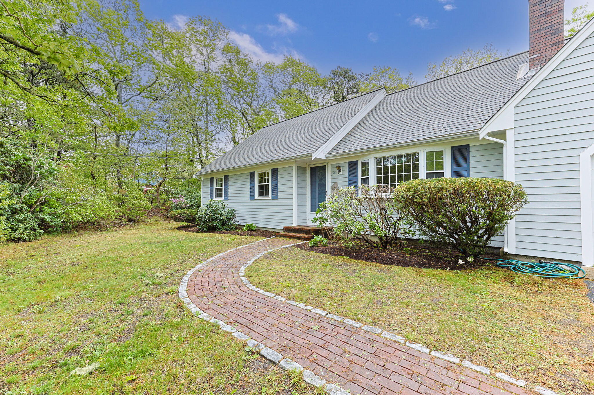 8 Bay Pine Road Harwich, MA 02645 - Photo 1 of 28 a front view of a house with garden