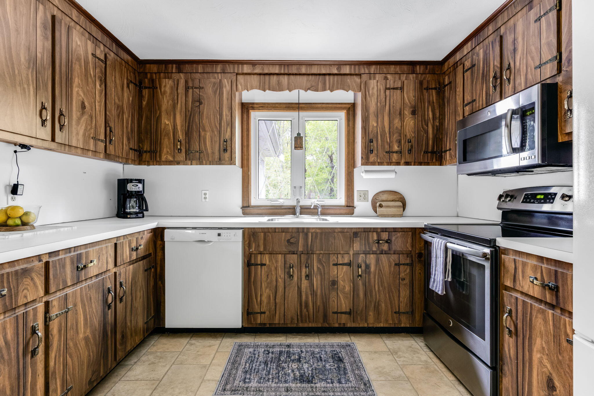 8 Bay Pine Road Harwich, MA 02645 - Photo 12 of 28 a kitchen with stainless steel appliances granite countertop a sink and a stove