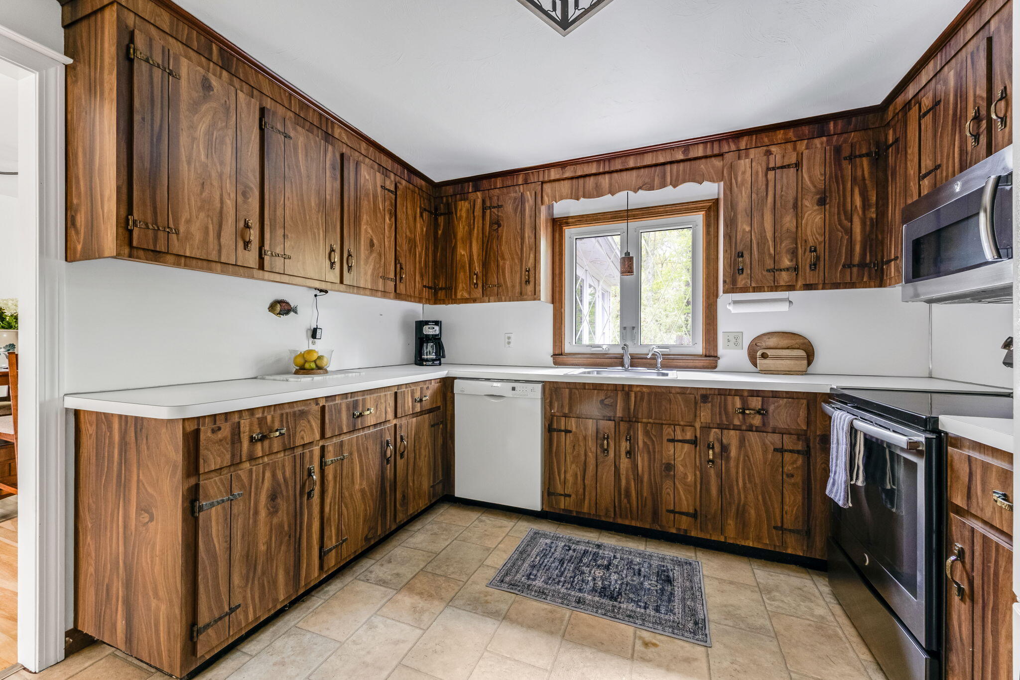 8 Bay Pine Road Harwich, MA 02645 - Photo 13 of 28 a kitchen with a sink window and cabinets