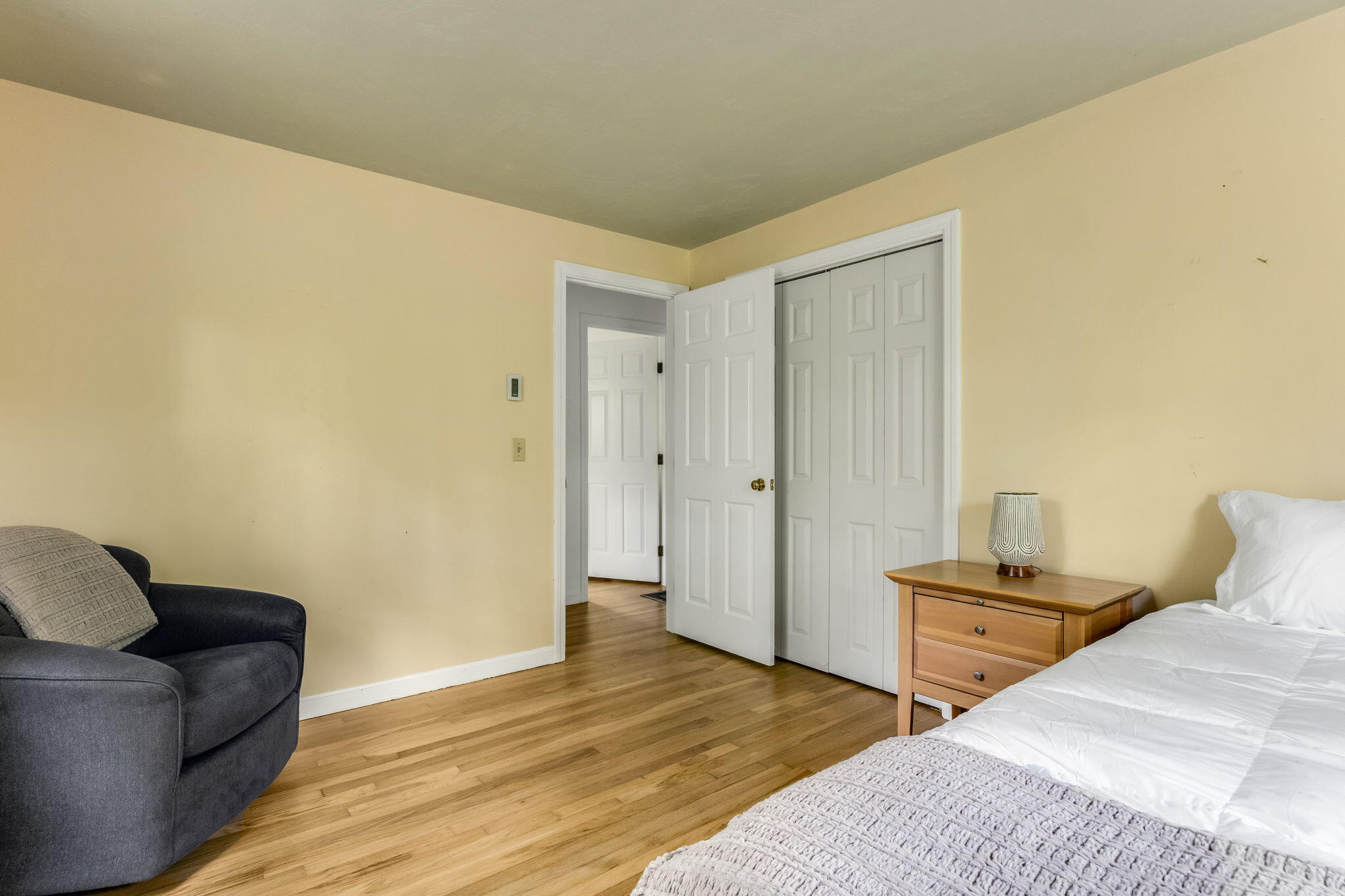 8 Bay Pine Road Harwich, MA 02645 - Photo 19 of 28 a bedroom with a bed and wooden floor