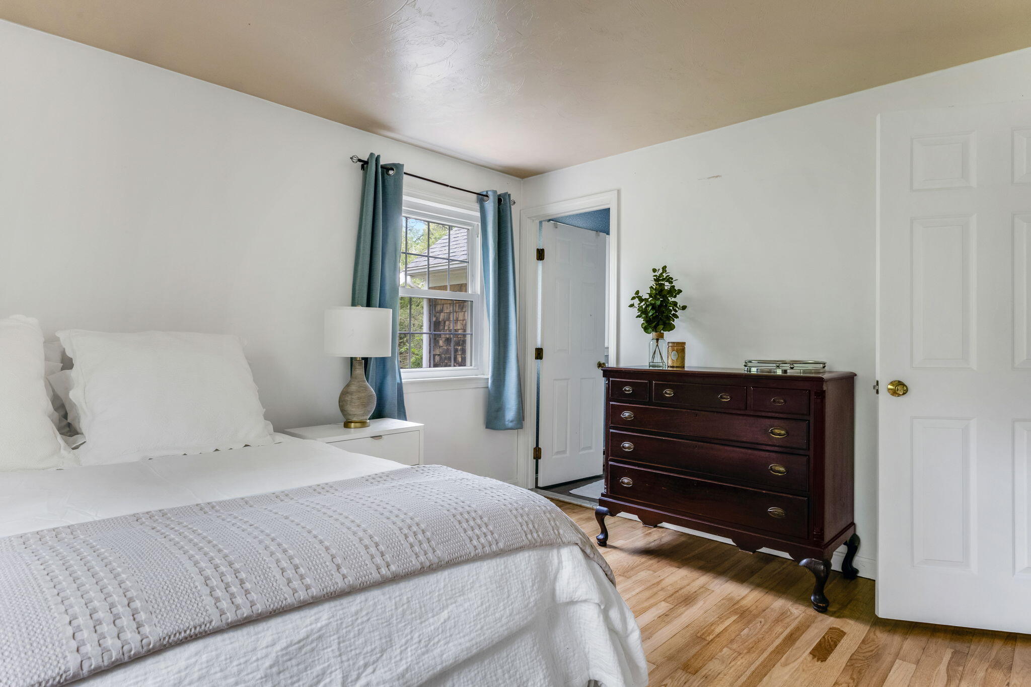 8 Bay Pine Road Harwich, MA 02645 - Photo 22 of 28 a bedroom with a bed and a dresser