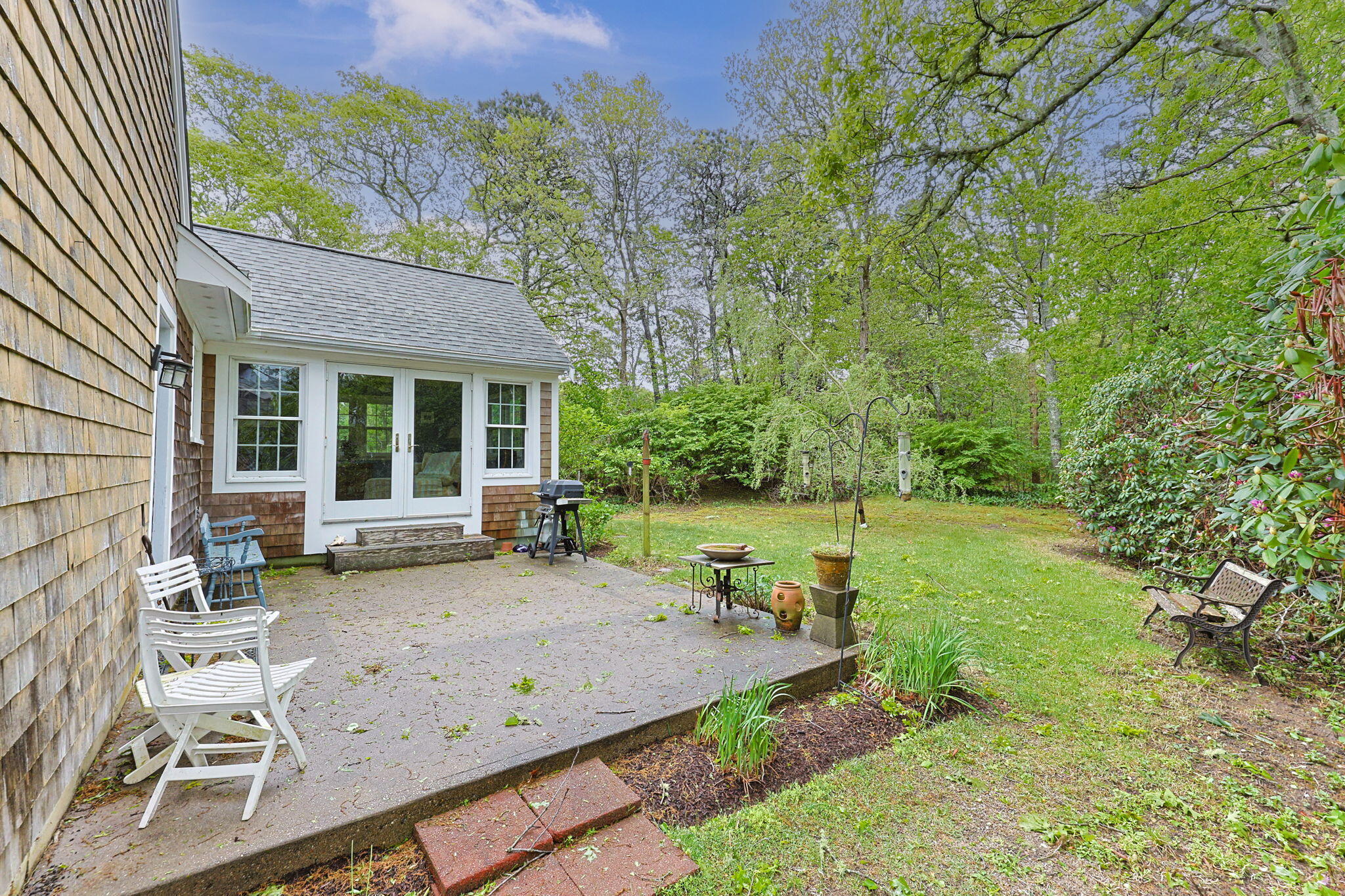 8 Bay Pine Road Harwich, MA 02645 - Photo 24 of 28 a view of a house with backyard sitting area and garden