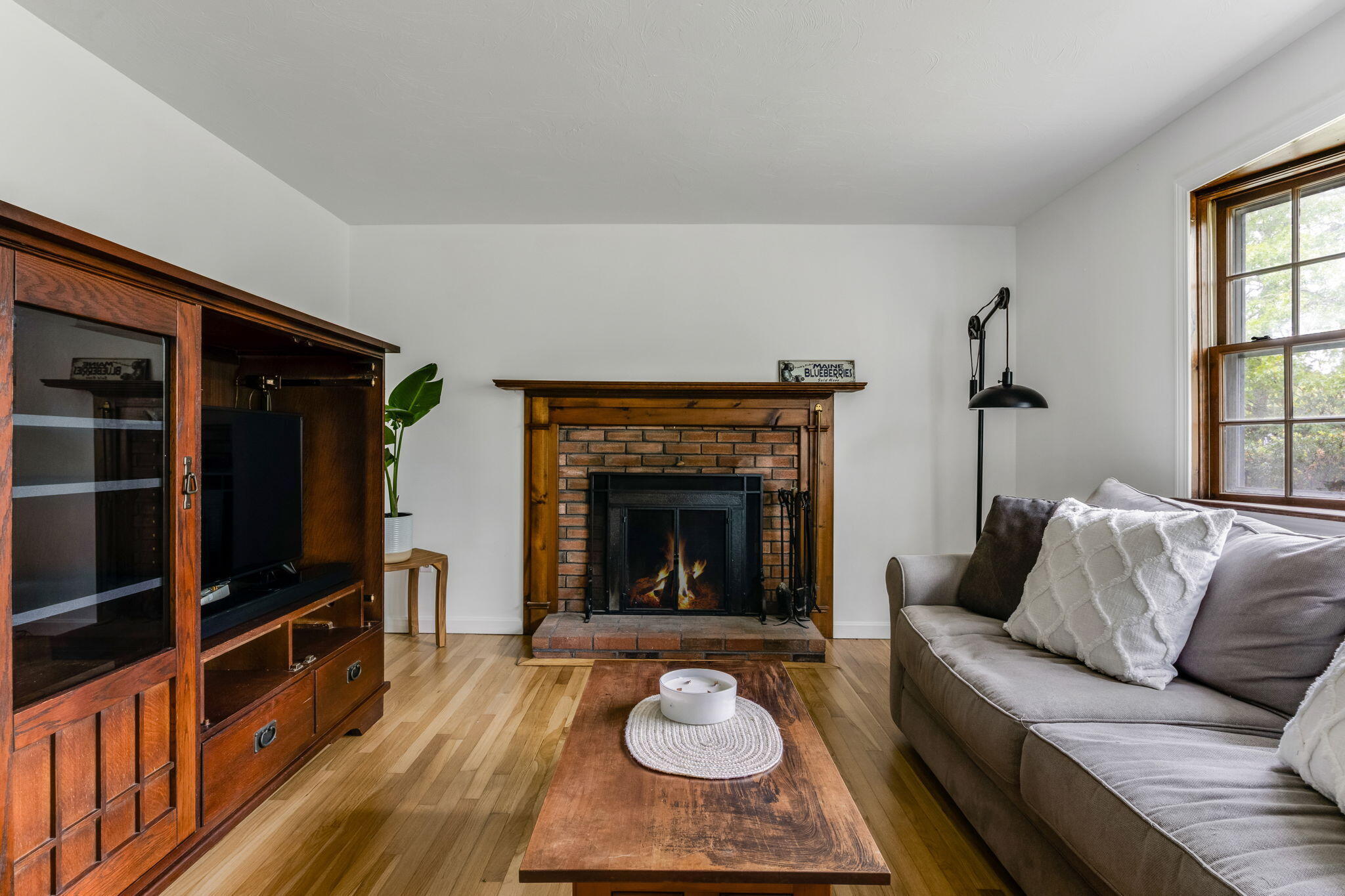 8 Bay Pine Road Harwich, MA 02645 - Photo 5 of 28 a living room with furniture and a fireplace