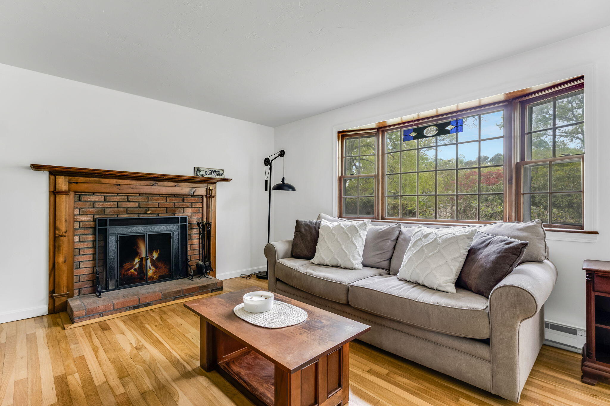 8 Bay Pine Road Harwich, MA 02645 - Photo 6 of 28 a living room with furniture and a fireplace