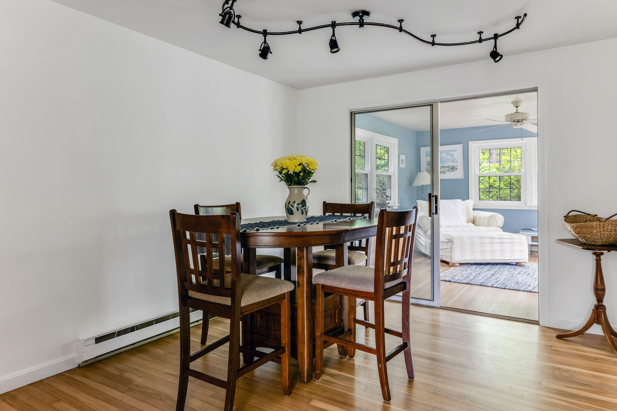 8 Bay Pine Road Harwich, MA 02645 - Photo 7 of 28 a view of a dining room with furniture and a chandelier