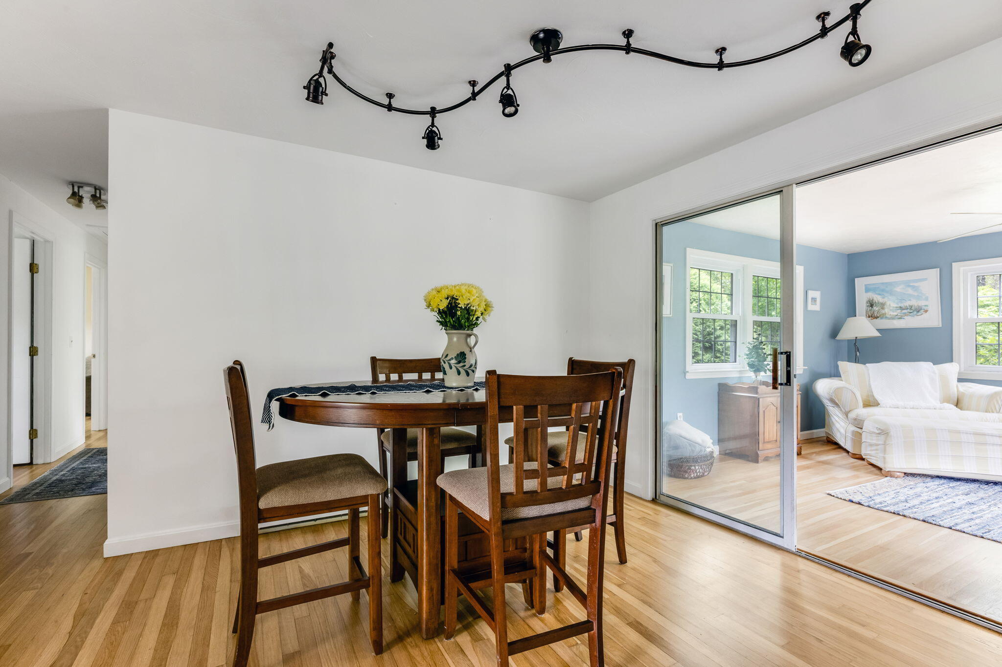8 Bay Pine Road Harwich, MA 02645 - Photo 8 of 28 a view of a dining room with furniture and wooden floor