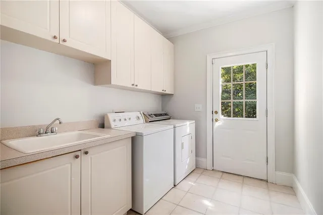 an empty room with windows and ceiling fan