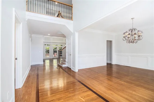a view of an entryway with wooden floor and door