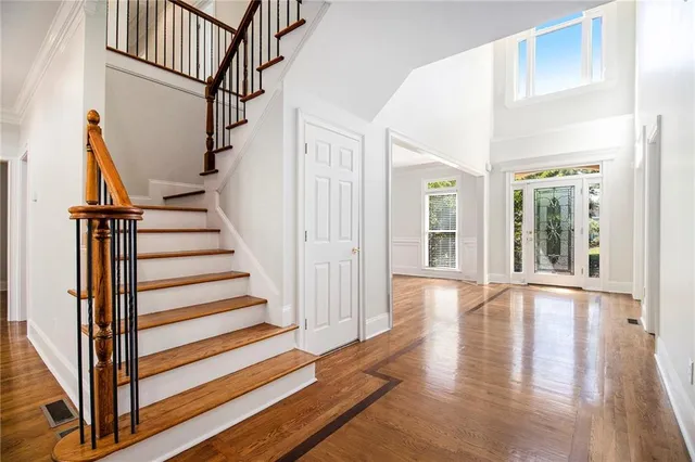 a living room with furniture fireplace and a large window